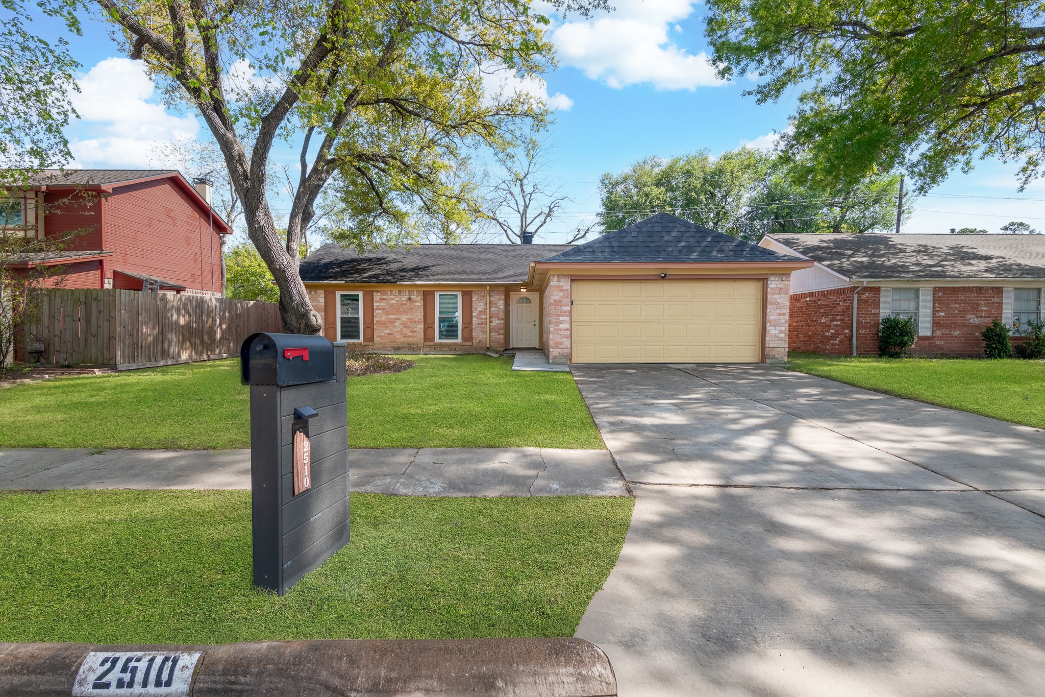 2510 Marble Falls Drive Spring, TX 77373 - Photo 2 of 26 a front view of a house with a yard and garage