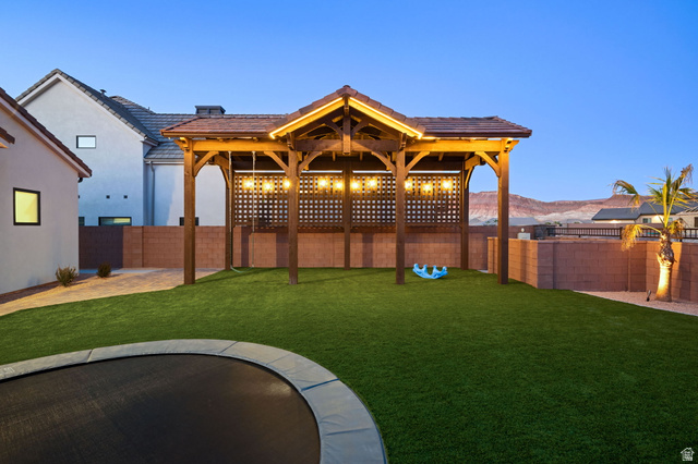 4871 South Homestead Way Washington, UT 84780 - Photo 114 of 151 Fenced backyard with a patio area and a mountain view