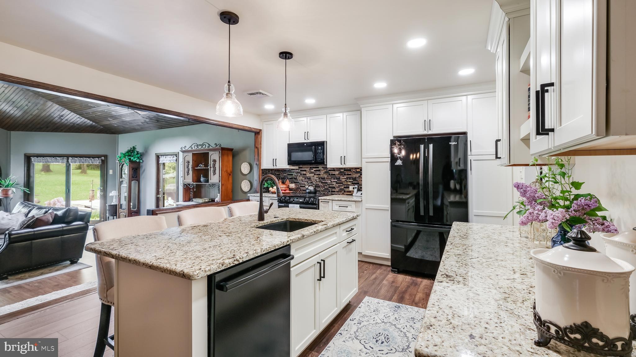 2370 Weir Road Aston, PA 19014 - Photo 10 of 36 Granite Counters & White Shaker Cabinets