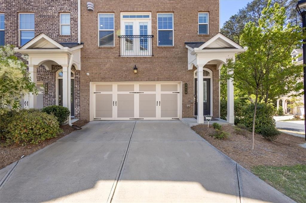 2056 Violet Lane Brookhaven, GA 30319 - Photo 3 of 54 a front view of a house with a yard and garage