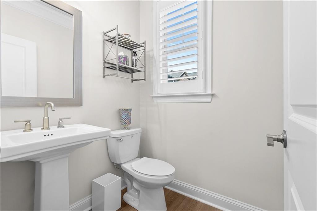 2056 Violet Lane Brookhaven, GA 30319 - Photo 52 of 54 a bathroom with a toilet a sink and mirror