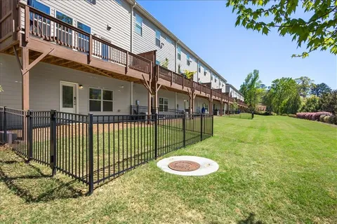 a kitchen with stainless steel appliances kitchen island granite countertop a stove a sink a refrigerator and a microwave