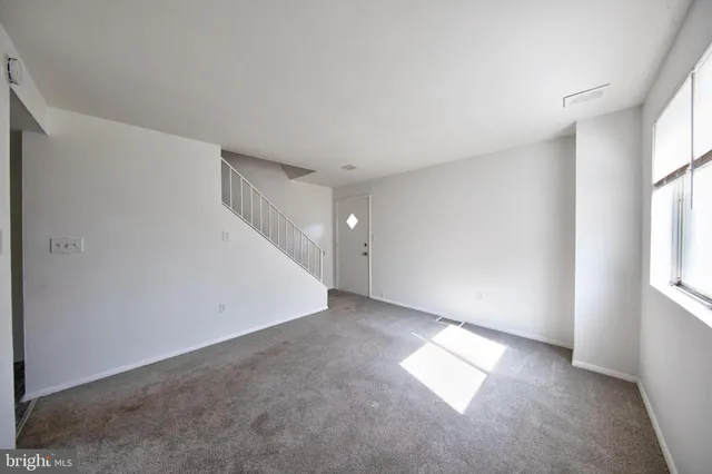 an empty room with windows