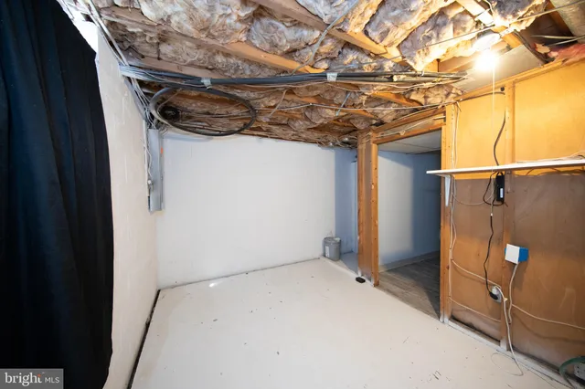 a view of a room with wooden walls