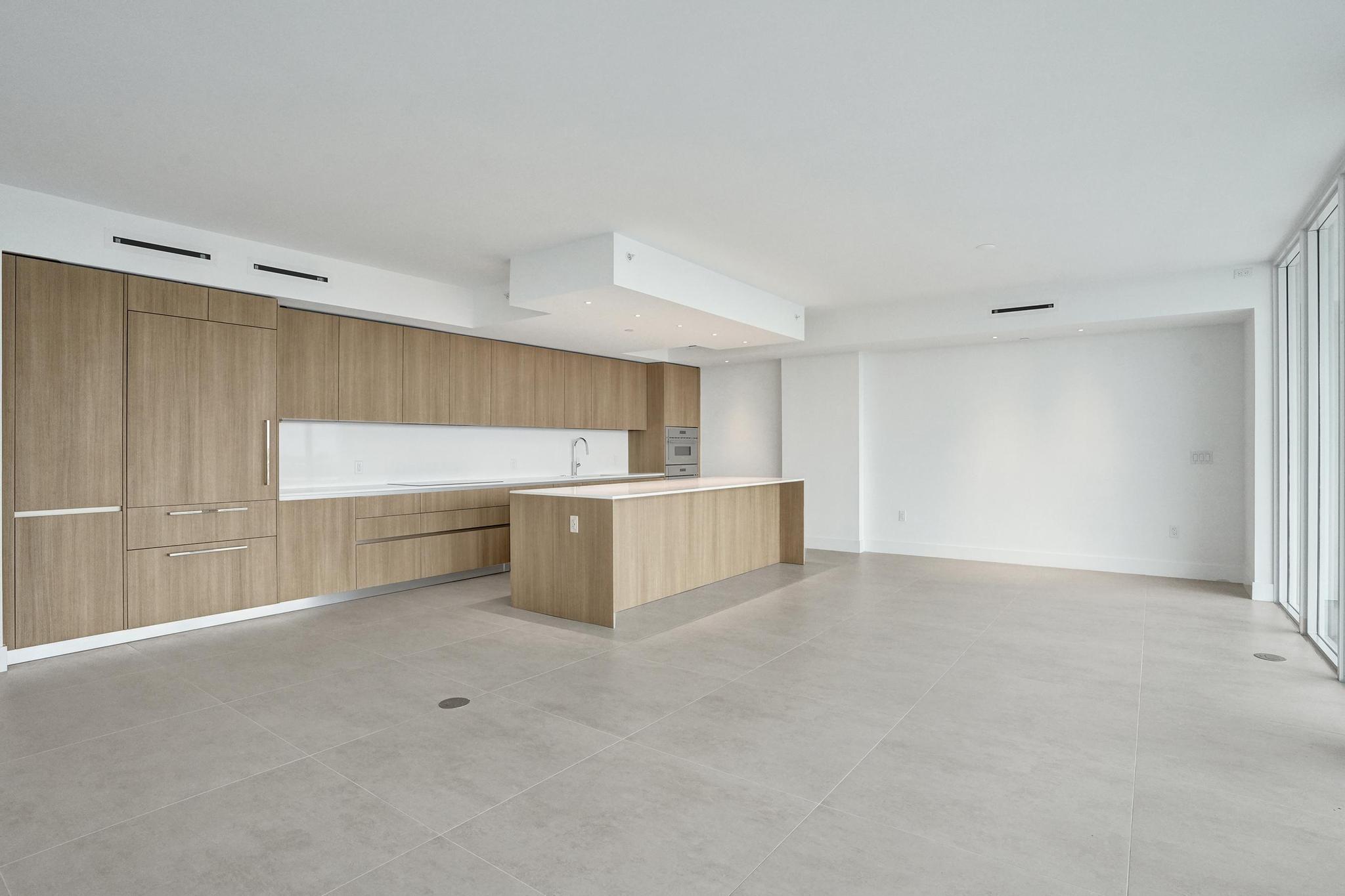 407 North Riverside Drive, Unit 602 Pompano Beach, FL 33062 - Photo 13 of 83 a view of a kitchen with a sink and cabinets