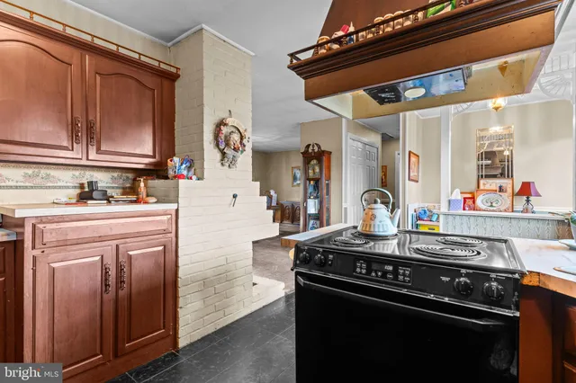 a kitchen with stainless steel appliances granite countertop a stove and a refrigerator