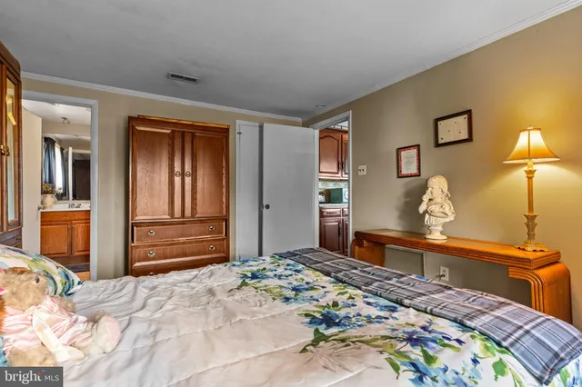 a bedroom with a bed and a dresser