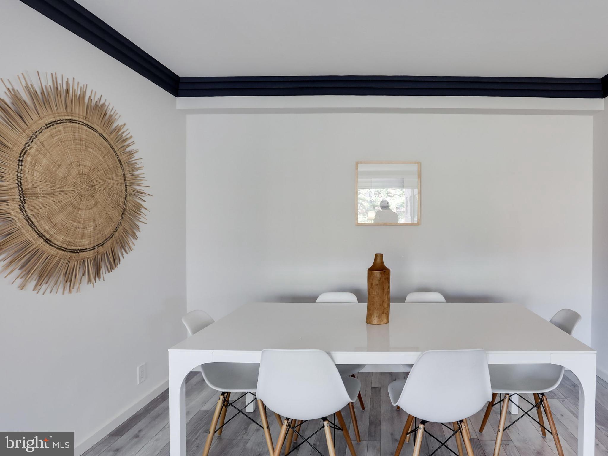 4201 Cathedral Avenue Northwest, Unit 703W Washington, DC 20016 - Photo 11 of 20 a view of a dining room with furniture and a window