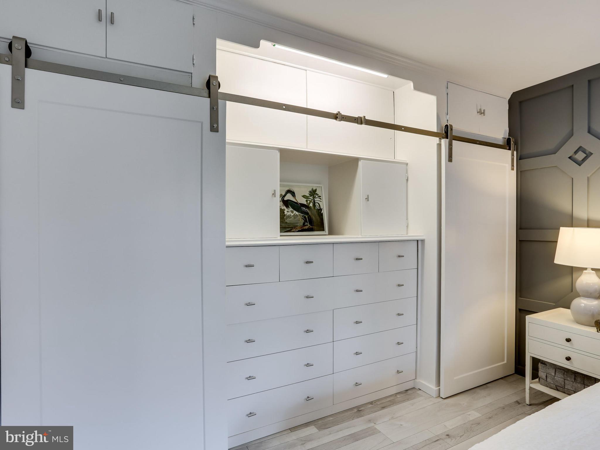 4201 Cathedral Avenue Northwest, Unit 703W Washington, DC 20016 - Photo 13 of 20 a bathroom with a mirror and a shower