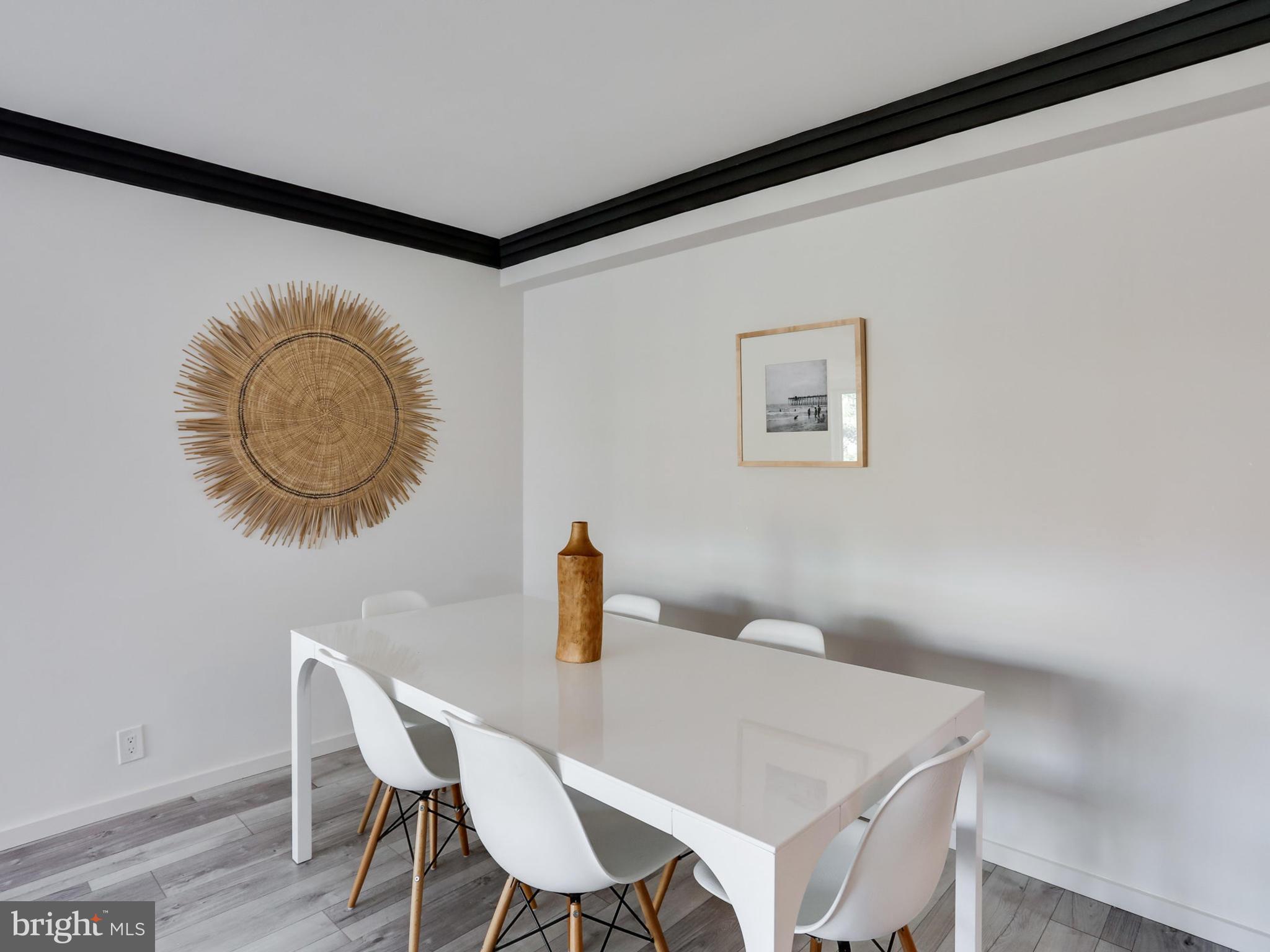 4201 Cathedral Avenue Northwest, Unit 703W Washington, DC 20016 - Photo 10 of 20 a view of a dining room with furniture and wooden floor