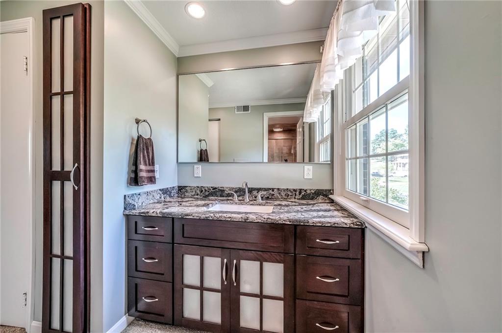 161 North Jamestown Road Coraopolis, PA 15108 - Photo 14 of 25 The updated master ensuite features a large vanity and creative storage solutions.