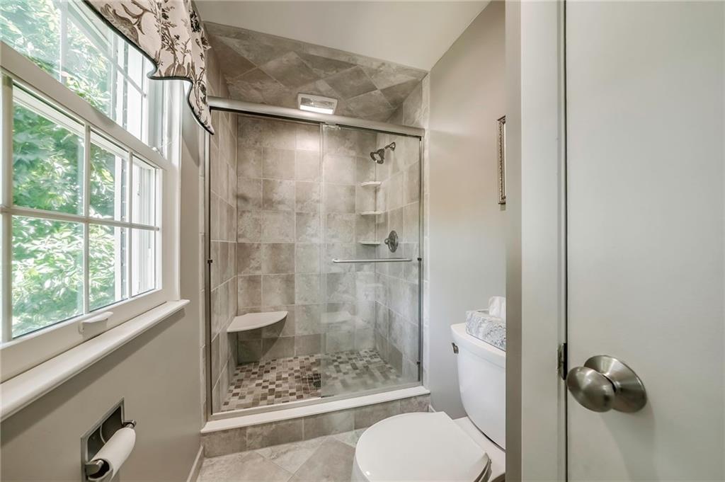 161 North Jamestown Road Coraopolis, PA 15108 - Photo 15 of 25 The spa-like shower in the master bathroom is sure to impress thanks to the fancy tile work easily visible through the seamless shower doors.