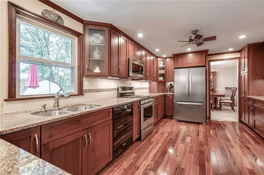 161 North Jamestown Road Coraopolis, PA 15108 - Photo 3 of 25 Stunning hardwoods accent the recently updated kitchen with custom cabinets, stainless steel appliances, and granite countertops.