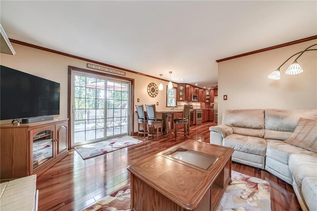 161 North Jamestown Road Coraopolis, PA 15108 - Photo 8 of 25 The family room is open to the kitchen and provides access to the large deck.