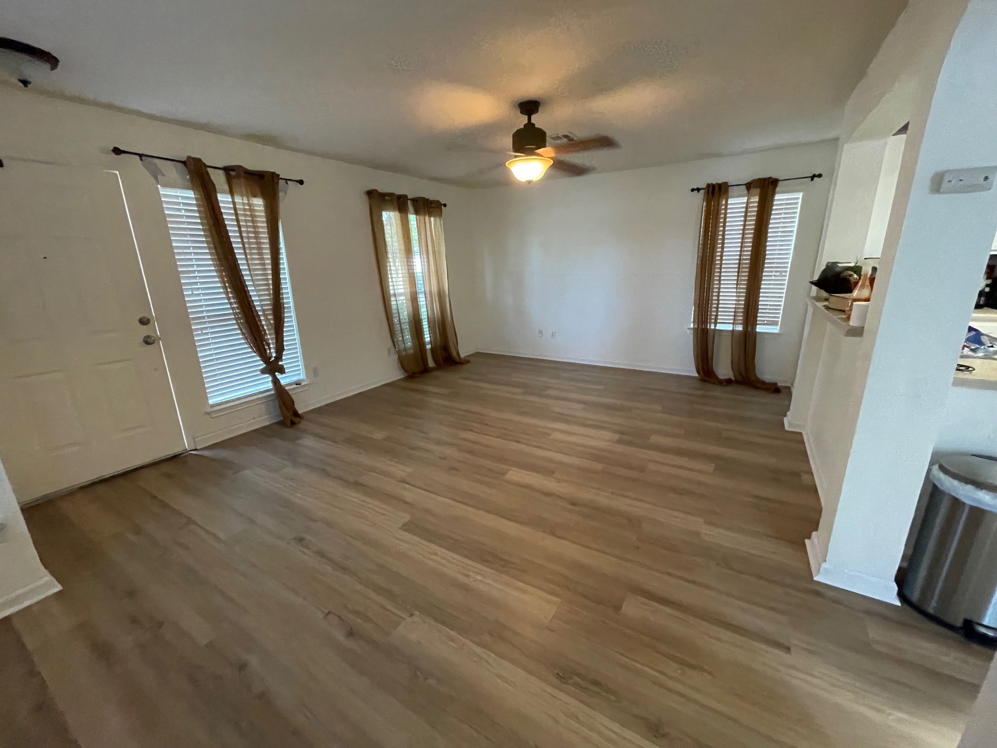 1000 Berry Bend Path Round Rock, TX 78664 - Photo 3 of 20 A versatile living area features durable wood flooring and ample natural light.