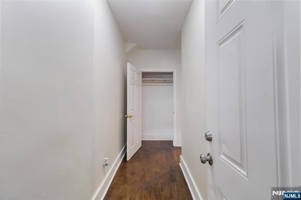 422 Jelliff Avenue, Unit 1 Newark, NJ 07112 - Photo 2 of 14 a view of a hallway with a white walls
