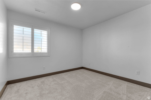 2724 Mt Jordan Road Sandy, UT 84092 - Photo 25 of 33 Carpeted spare room with baseboards