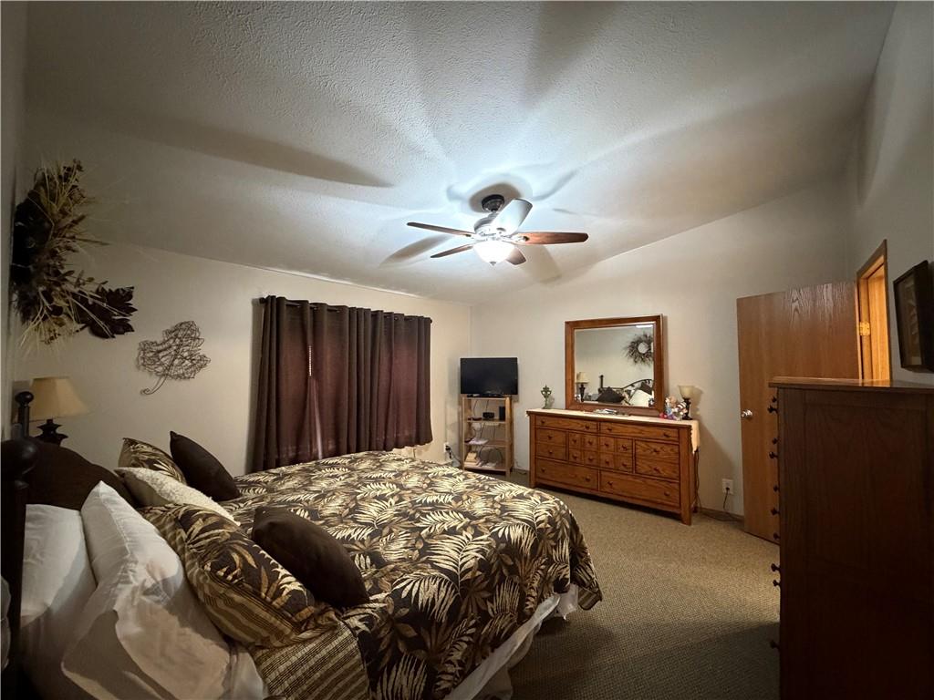 1881 Westford Road Jamestown, PA 16134 - Photo 28 of 50 a bedroom with a bed and a chandelier