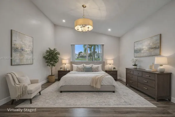 a bedroom with a large bed and a couch