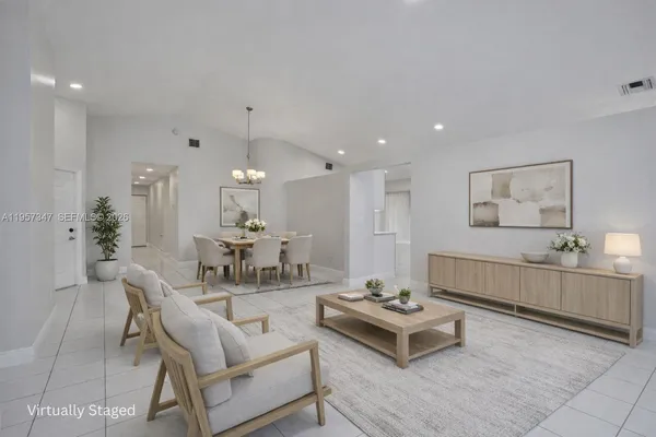 a view of an empty room with wooden floor and closet