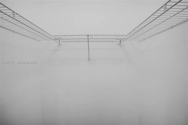 a kitchen with stainless steel appliances a stove sink and microwave