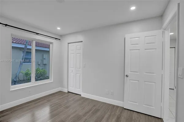 a kitchen with a sink and a stove top oven