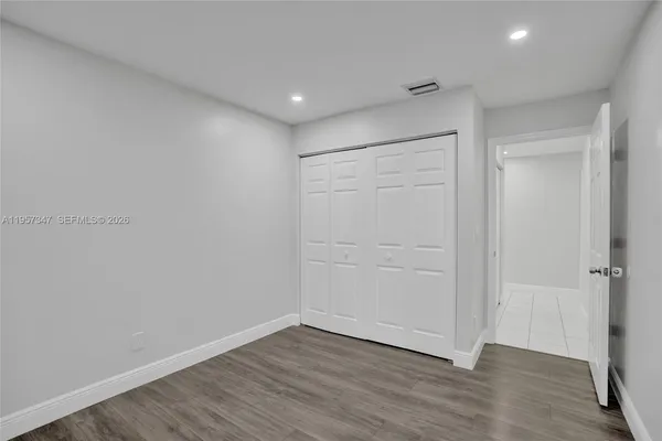 a bathroom with a sink vanity and mirror