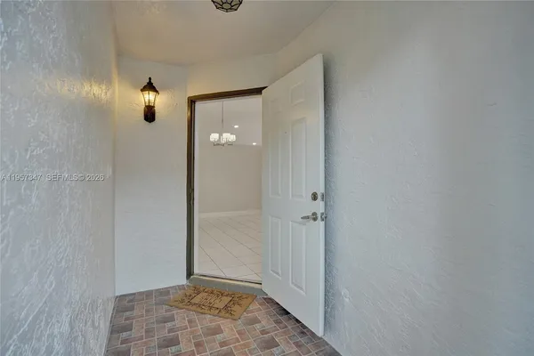 a spacious bathroom with a sink and a mirror