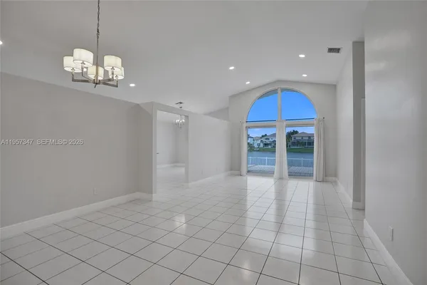 a view of a yard with a palm trees