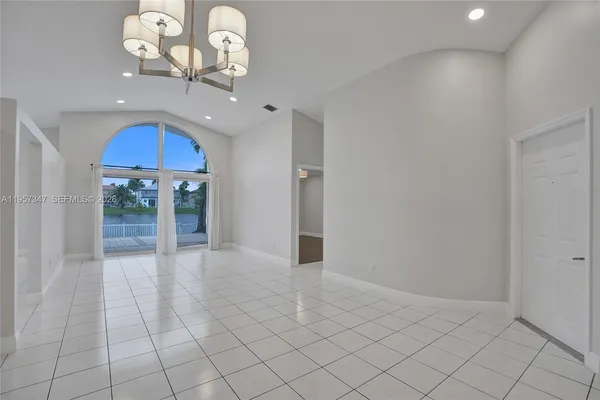 a view of a lake with houses in the back