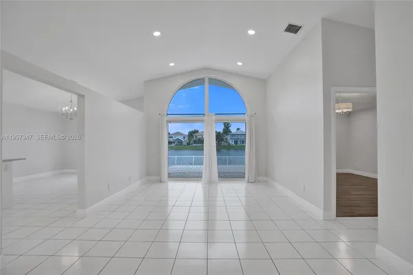 a view of a lake with houses in the background