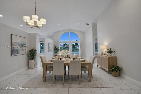 an empty room with wooden floor and window