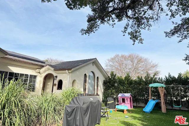 a front view of house with yard and entertaining space