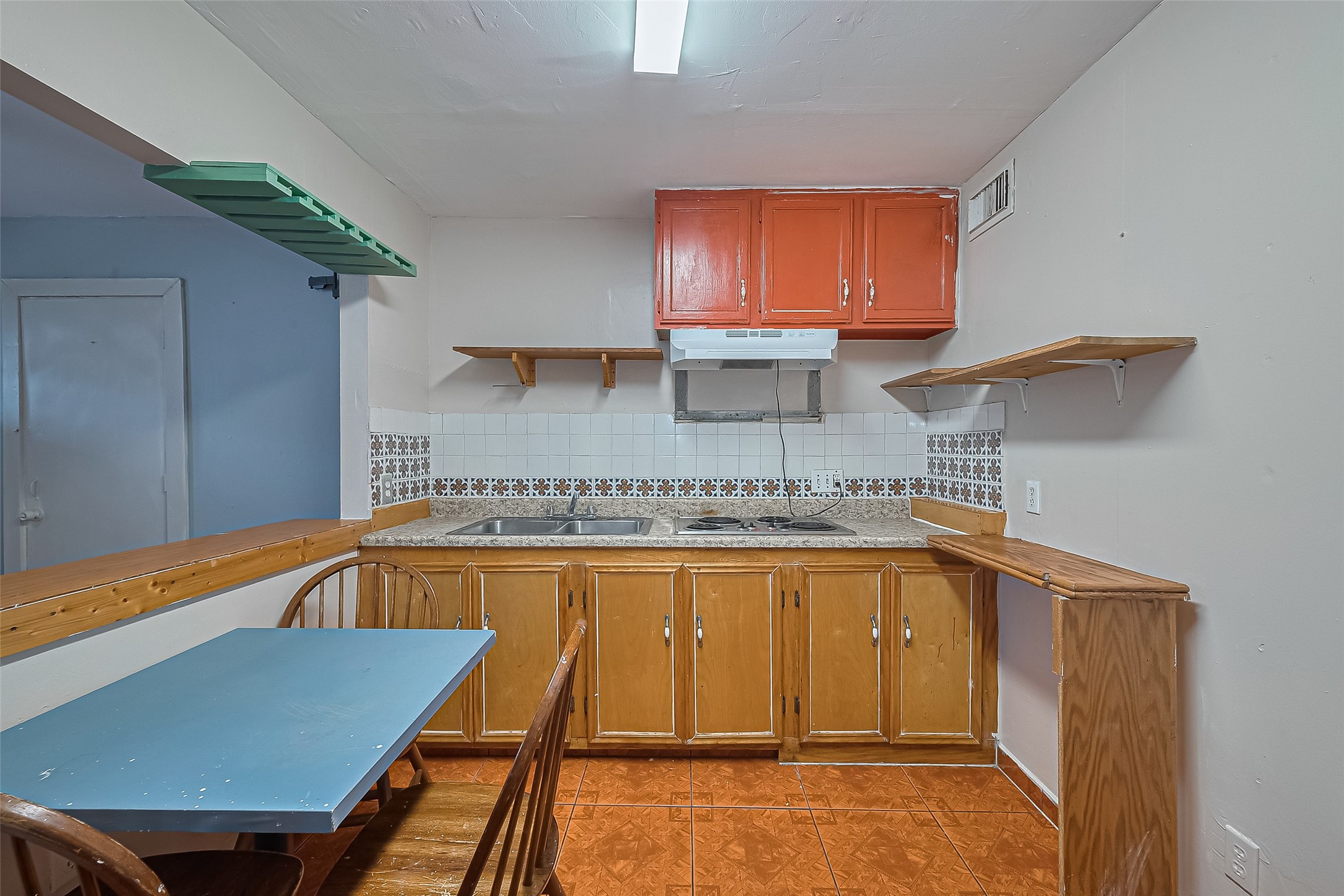 5012 Eigel Street Houston, TX 77007 - Photo 19 of 45 a kitchen with a sink and cabinets