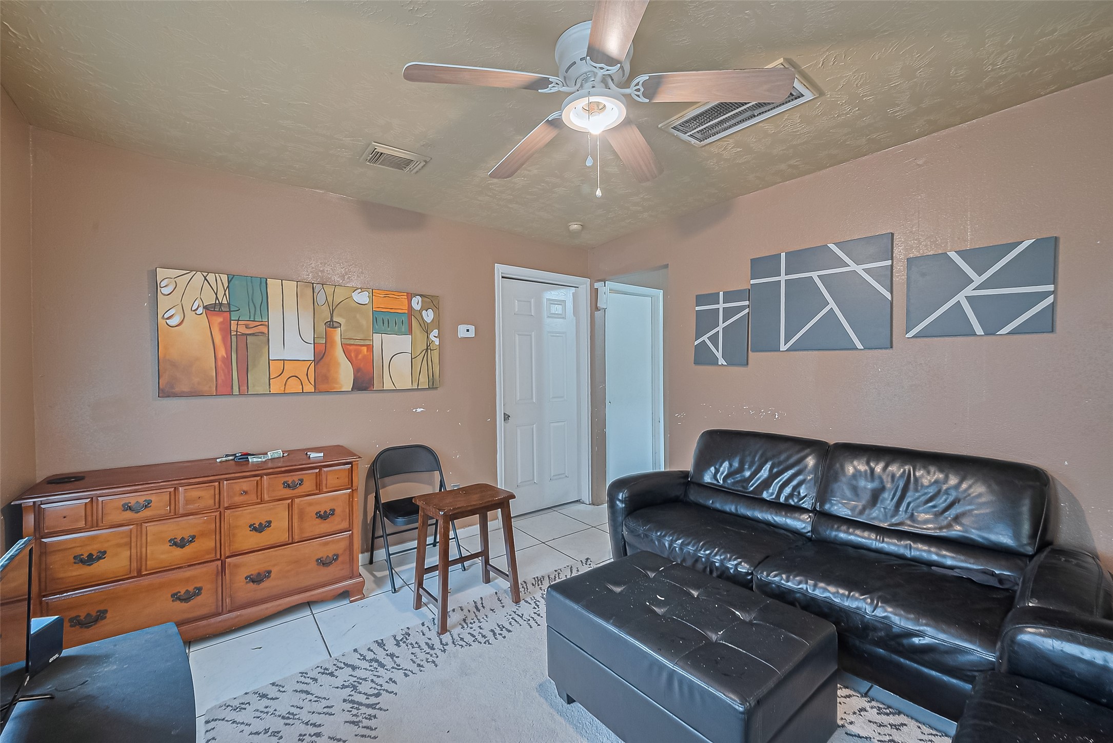 5012 Eigel Street Houston, TX 77007 - Photo 26 of 45 a living room with furniture and a baby crib
