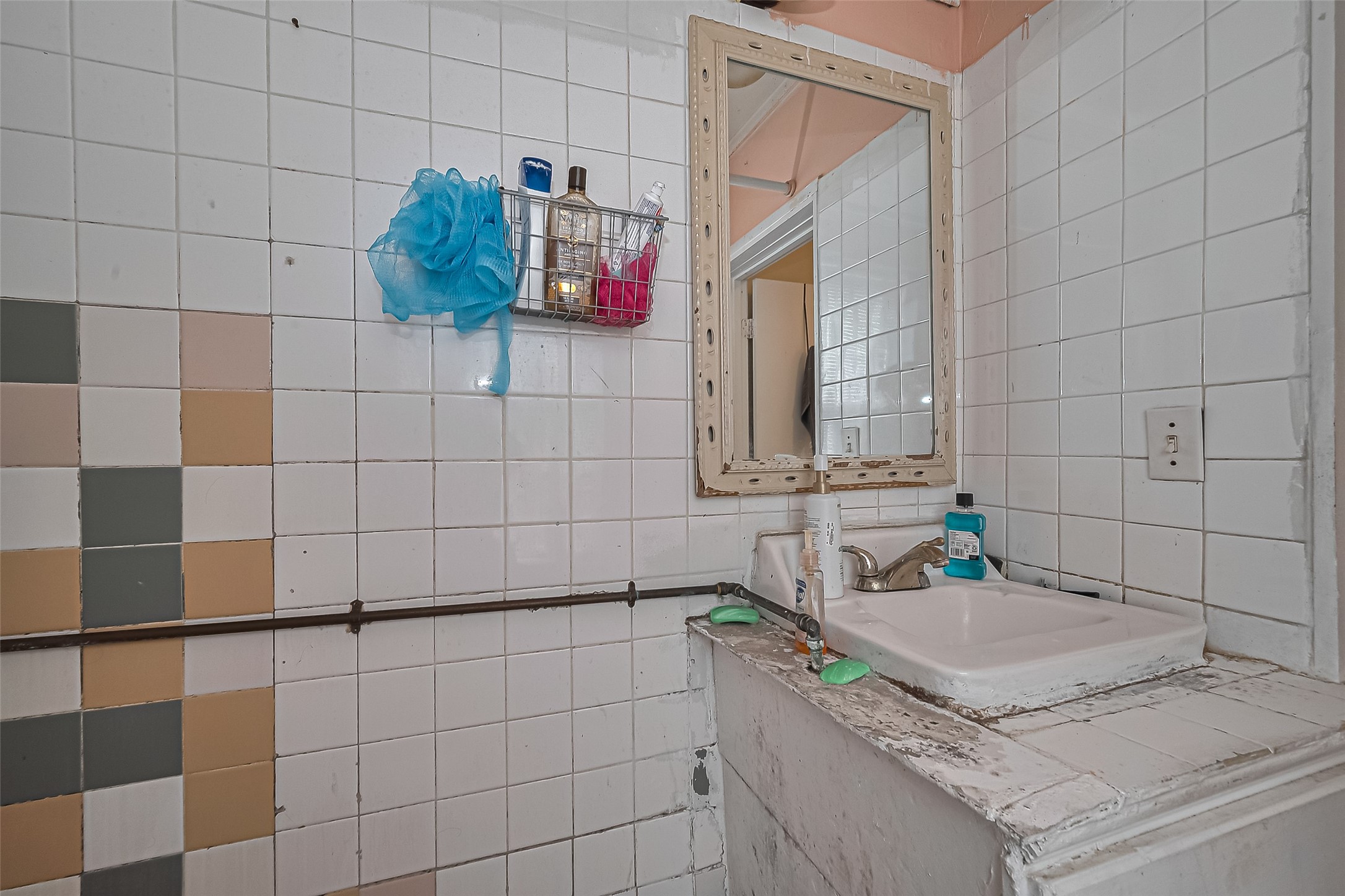 5012 Eigel Street Houston, TX 77007 - Photo 33 of 45 a bathroom with a granite countertop sink a mirror and shower