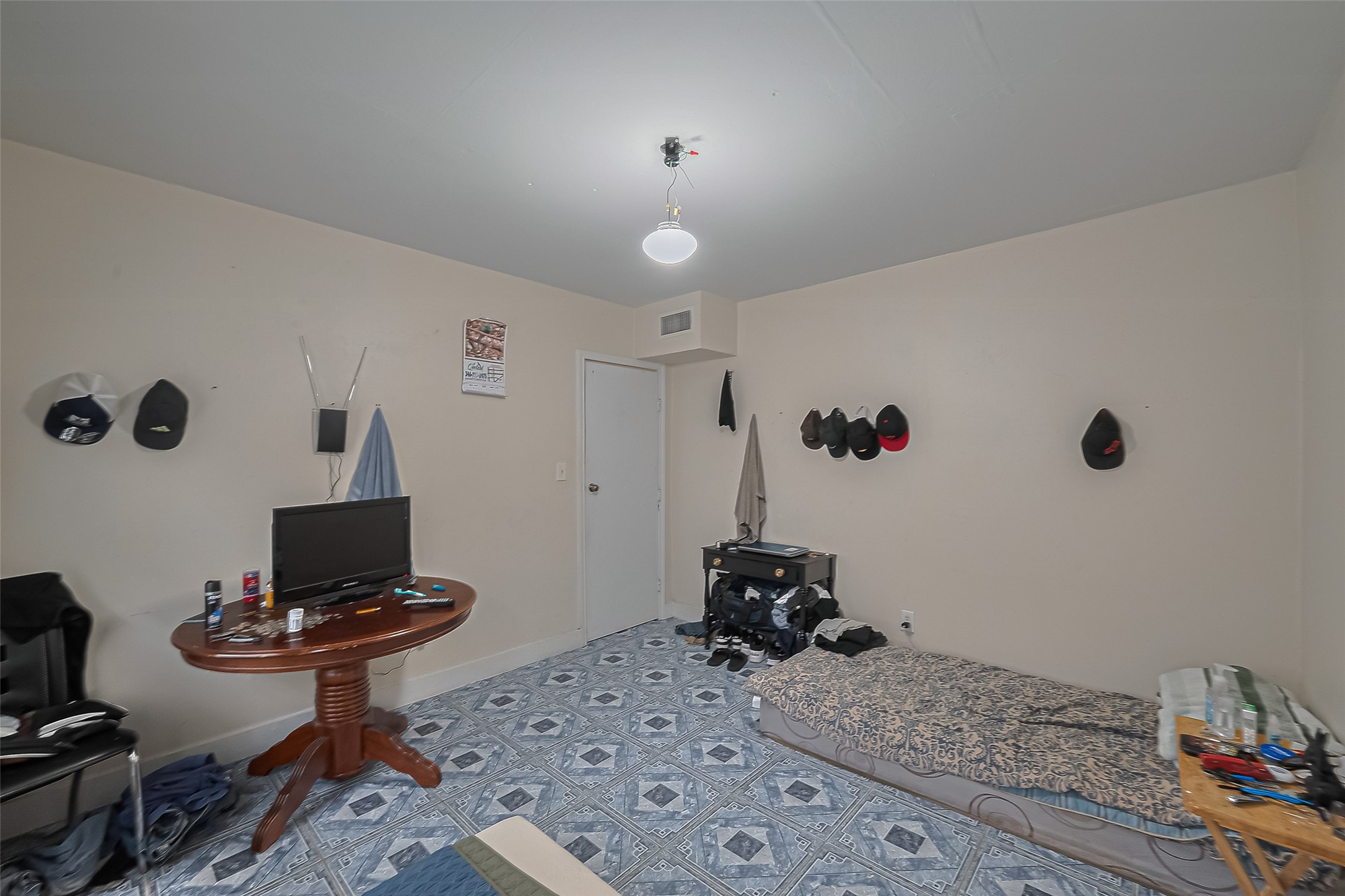 5012 Eigel Street Houston, TX 77007 - Photo 36 of 45 a bedroom with a bed and a chair