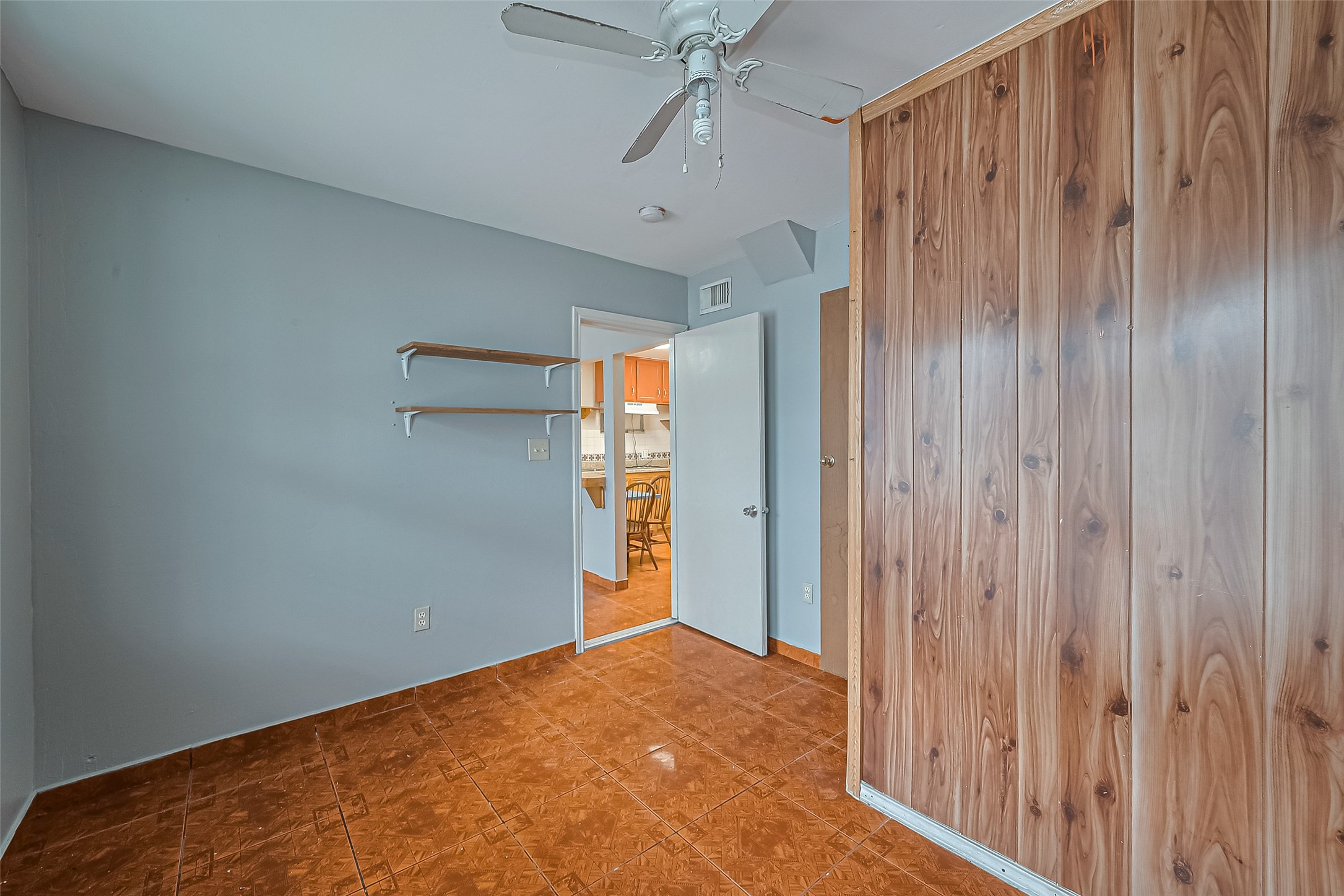 5012 Eigel Street Houston, TX 77007 - Photo 5 of 45 a view of a hallway with a chandelier fan and closet