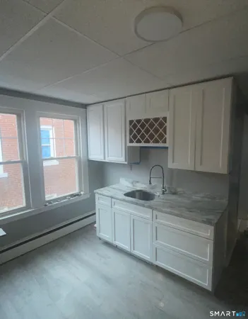 a kitchen with appliances cabinets and a sink
