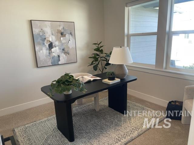 2035 Sumac Avenue Middleton, ID 83644 - Photo 10 of 17 Versatile room featuring a large window, neutral wall tones, carpeted flooring, and a decorative area rug