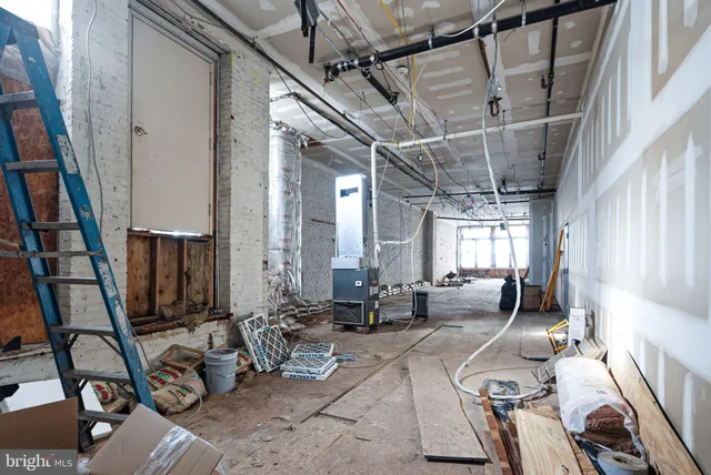 a room with lots of chairs and windows