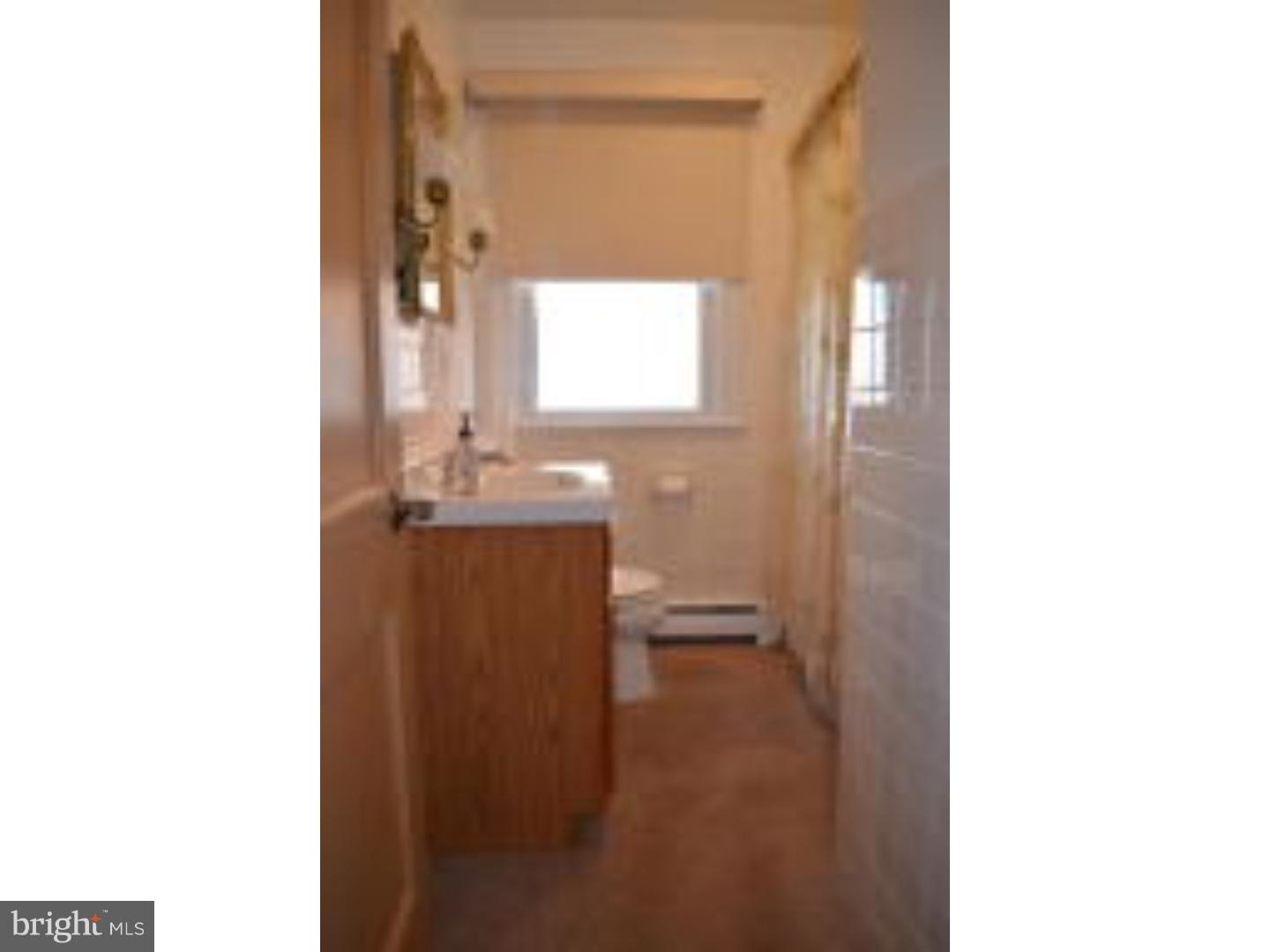 205 Old Fritztown Road Reading, PA 19607 - Photo 12 of 25 a bathroom with a sink a mirror and a toilet