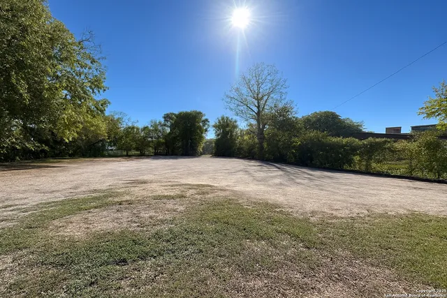 a view of backyard with green space