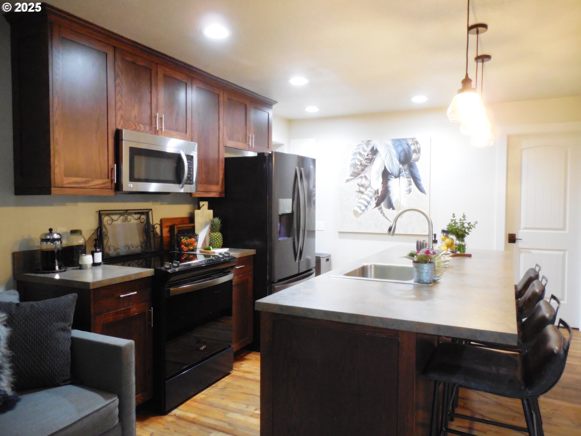 204 North Russell Street Joseph, OR 97846 - Photo 15 of 46 a kitchen with kitchen island a sink appliances and cabinets