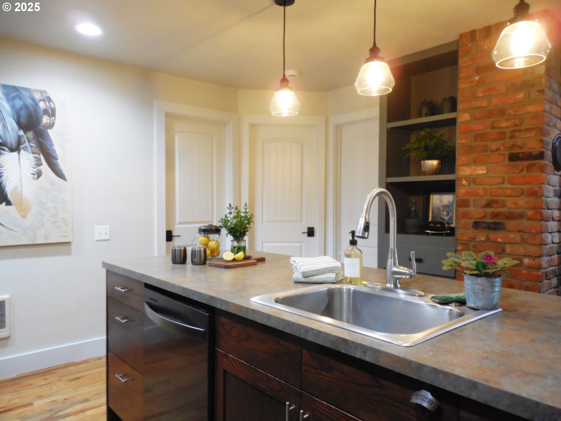 204 North Russell Street Joseph, OR 97846 - Photo 16 of 46 a kitchen with a sink and chandelier