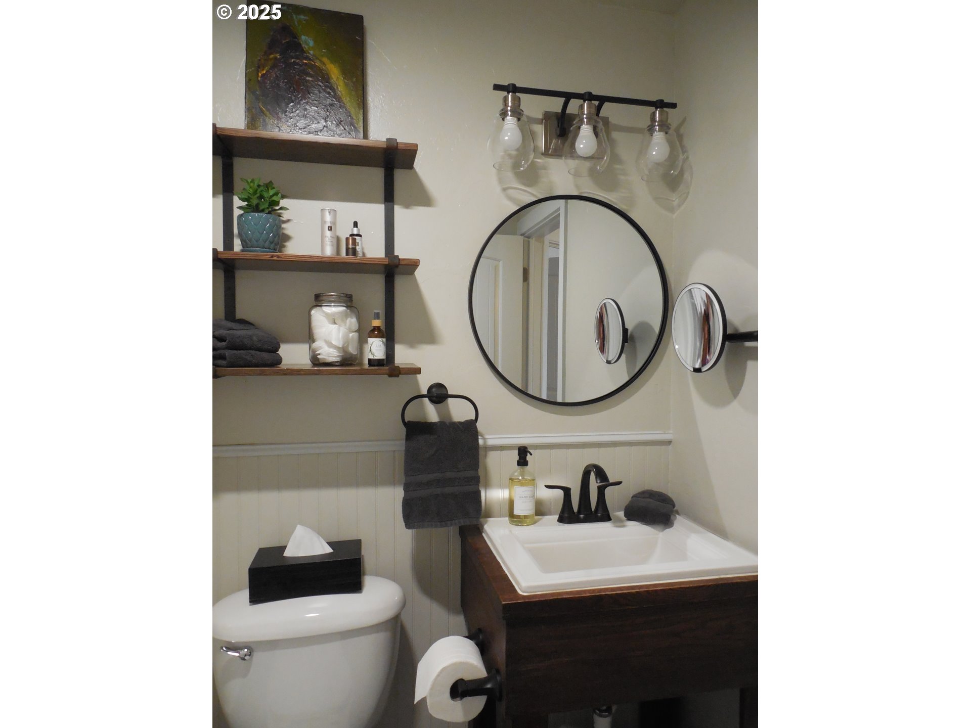 204 North Russell Street Joseph, OR 97846 - Photo 24 of 46 a bathroom with a toilet a sink and a mirror