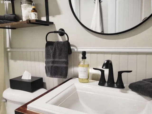 a close view of a sink and a mirror