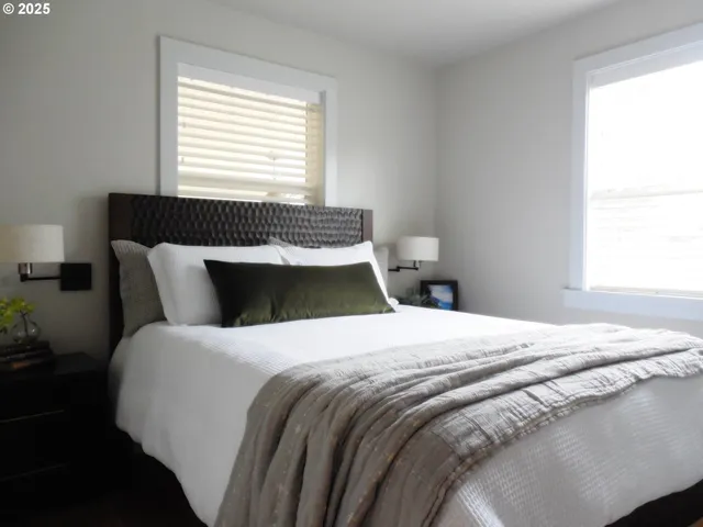 a bedroom with a bed and window