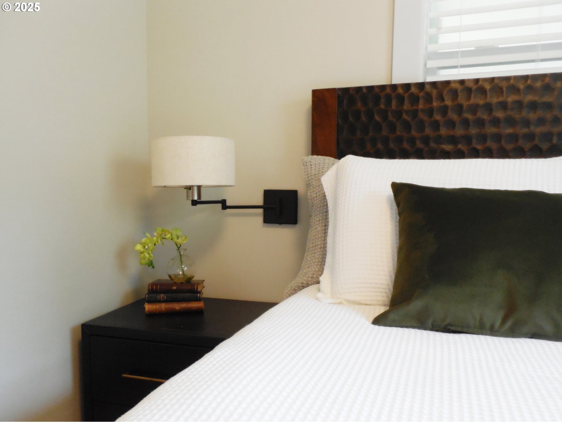 204 North Russell Street Joseph, OR 97846 - Photo 27 of 46 a bedroom with a bed and a lamp on dresser