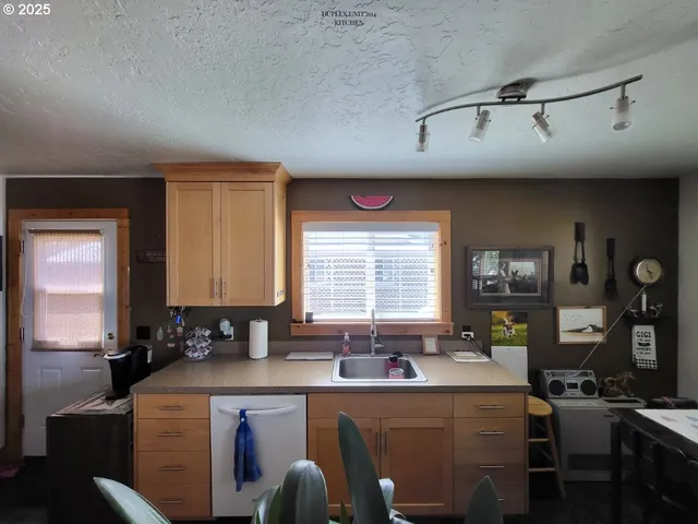 a kitchen with a stove and cabinets